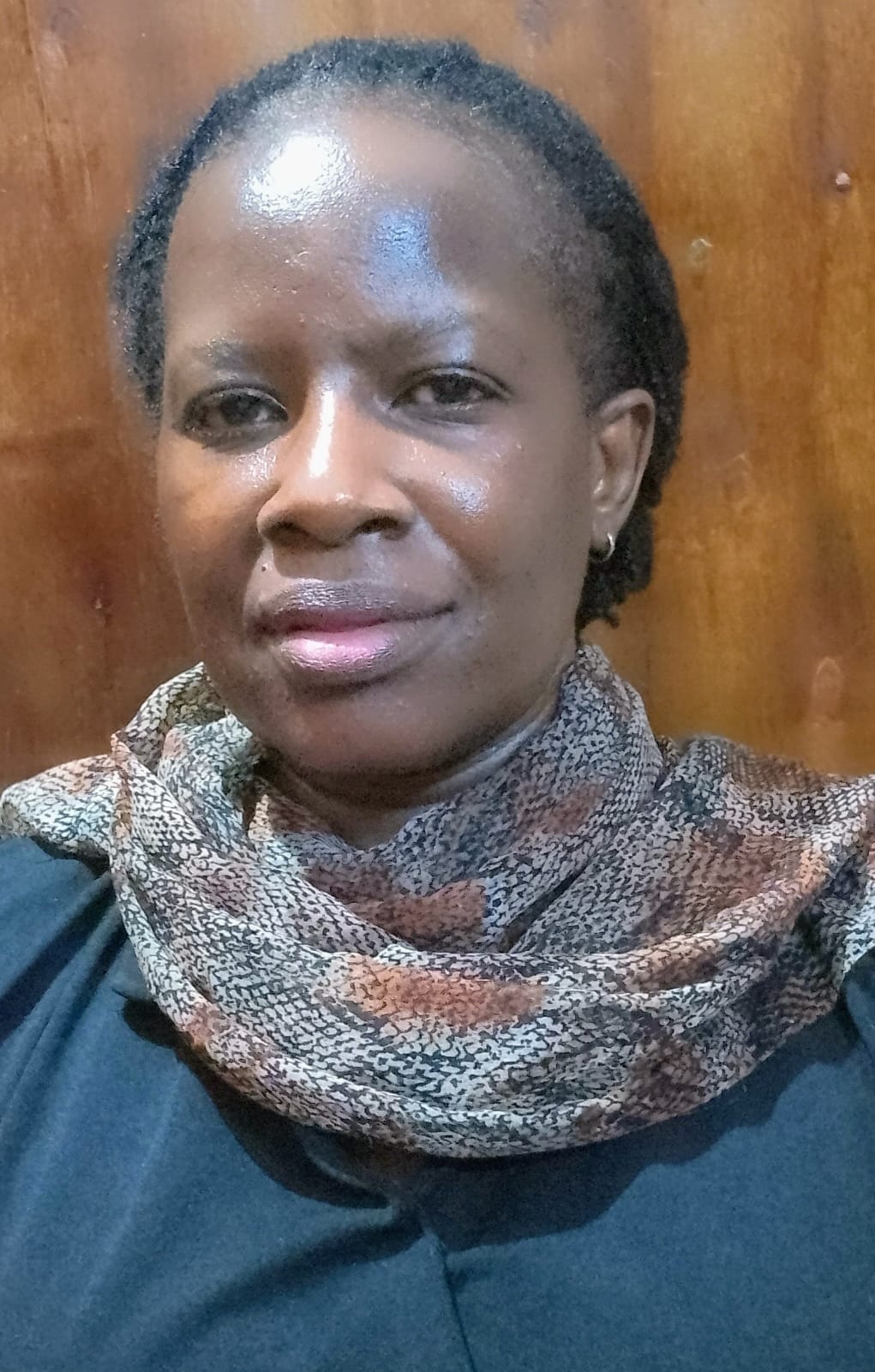 Ms Anne Aluku